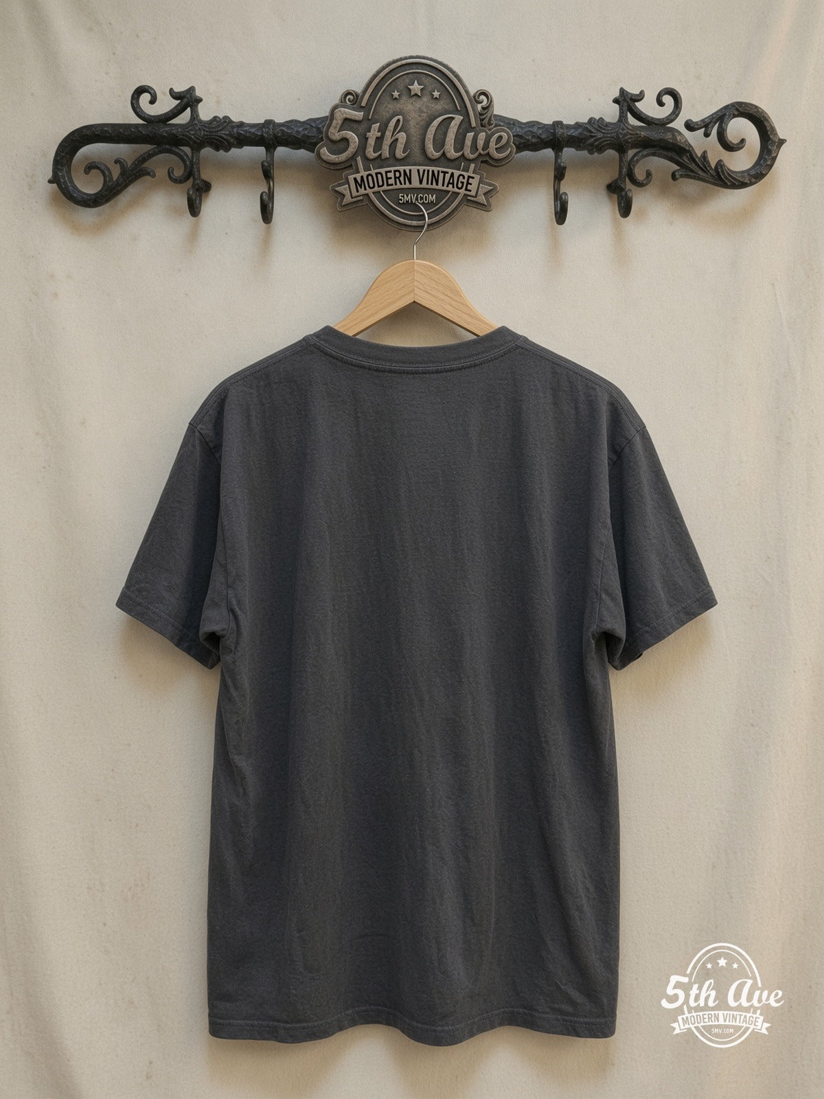 Nirvana – KURT COBAIN – Vintage Band T-Shirt — back on locked cream ornate 5th Ave rack