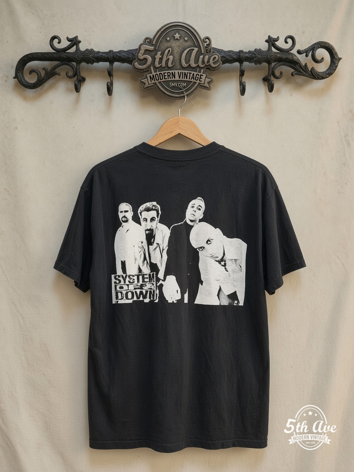 System of a Down – Genocide – Vintage Band T-Shirt — back on locked cream ornate 5th Ave rack