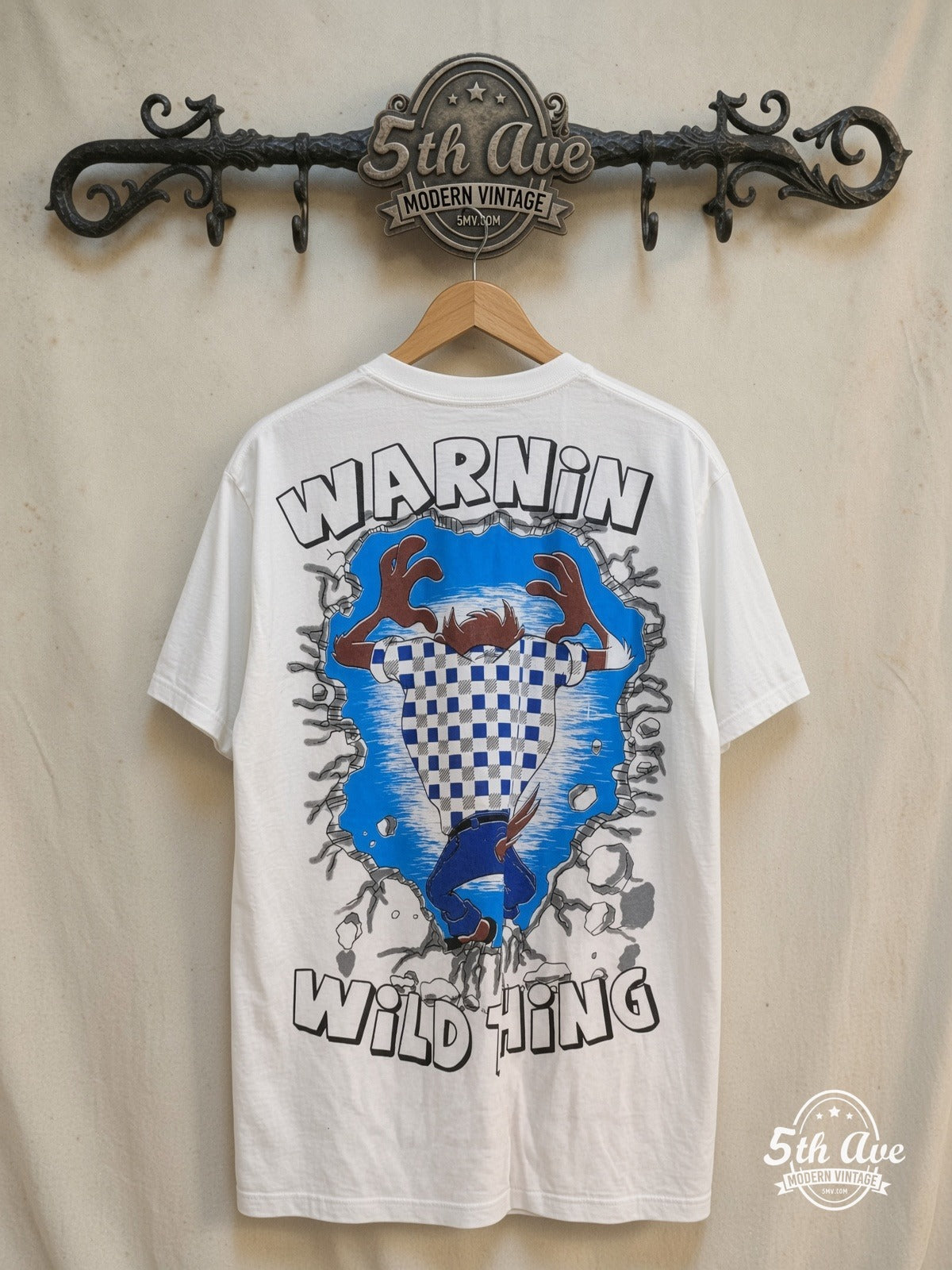 Looney Tunes Taz-Mania Warning Wild Thing graphic tee, back view on a display rack