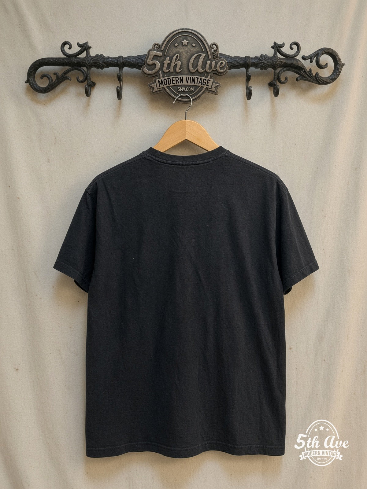 The Cure – Boys Don't Cry – Vintage Band T-Shirt — back on locked cream ornate 5th Ave rack