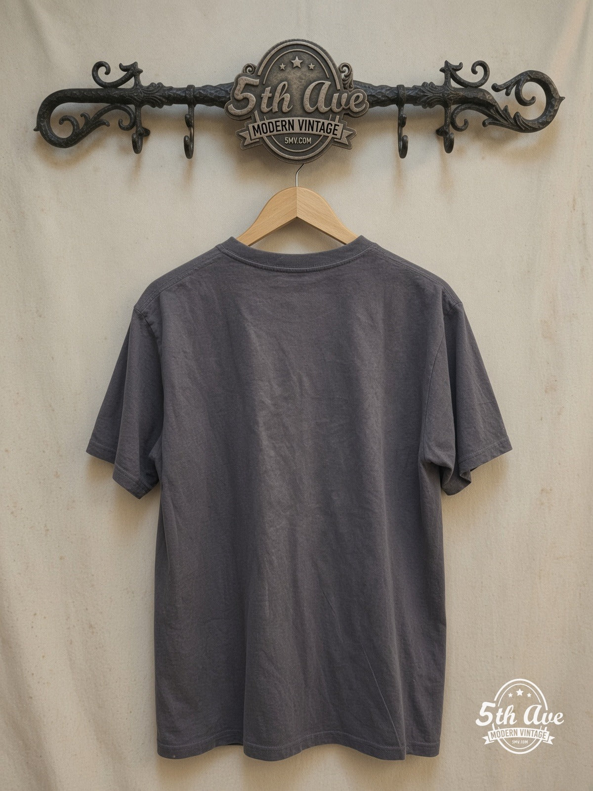 The Strokes – Vintage Band T-Shirt — back on locked cream ornate 5th Ave rack