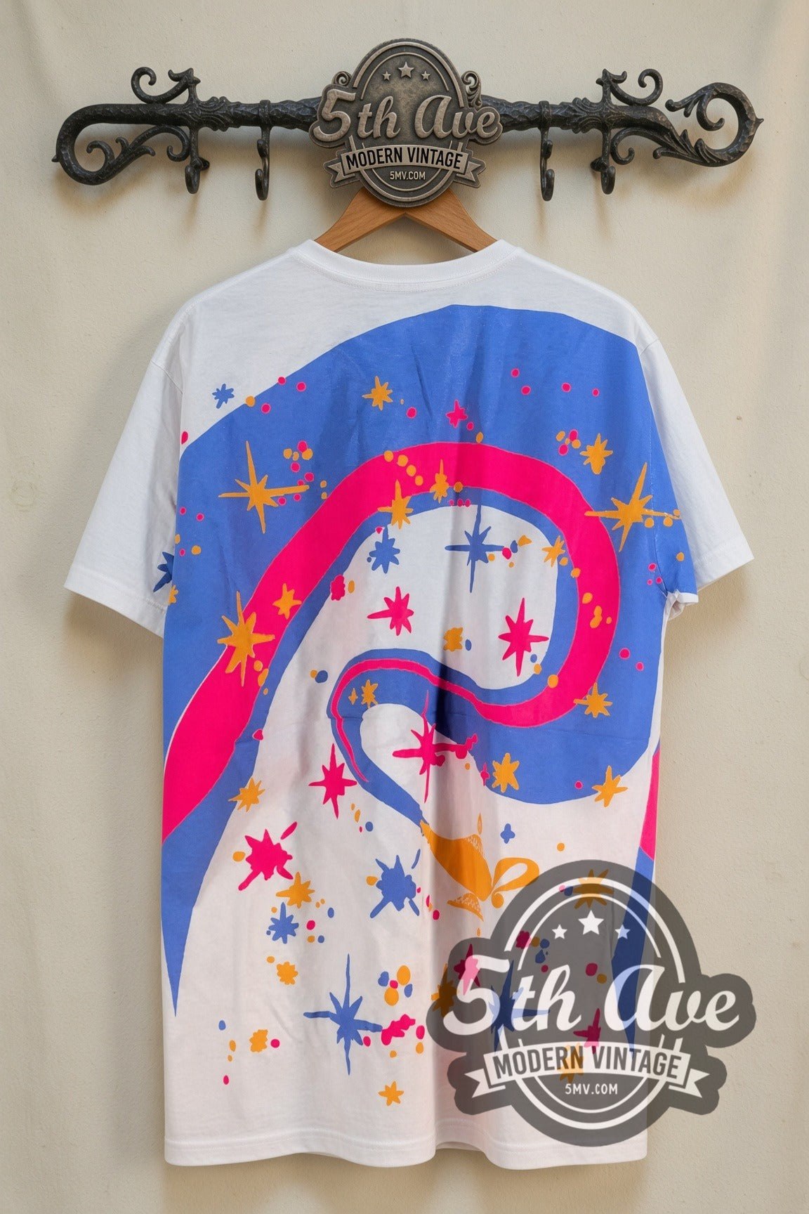 Disney Aladdin – Genie Lamp Swirl White All Over Print – vintage cartoon tee, front view on a display rack