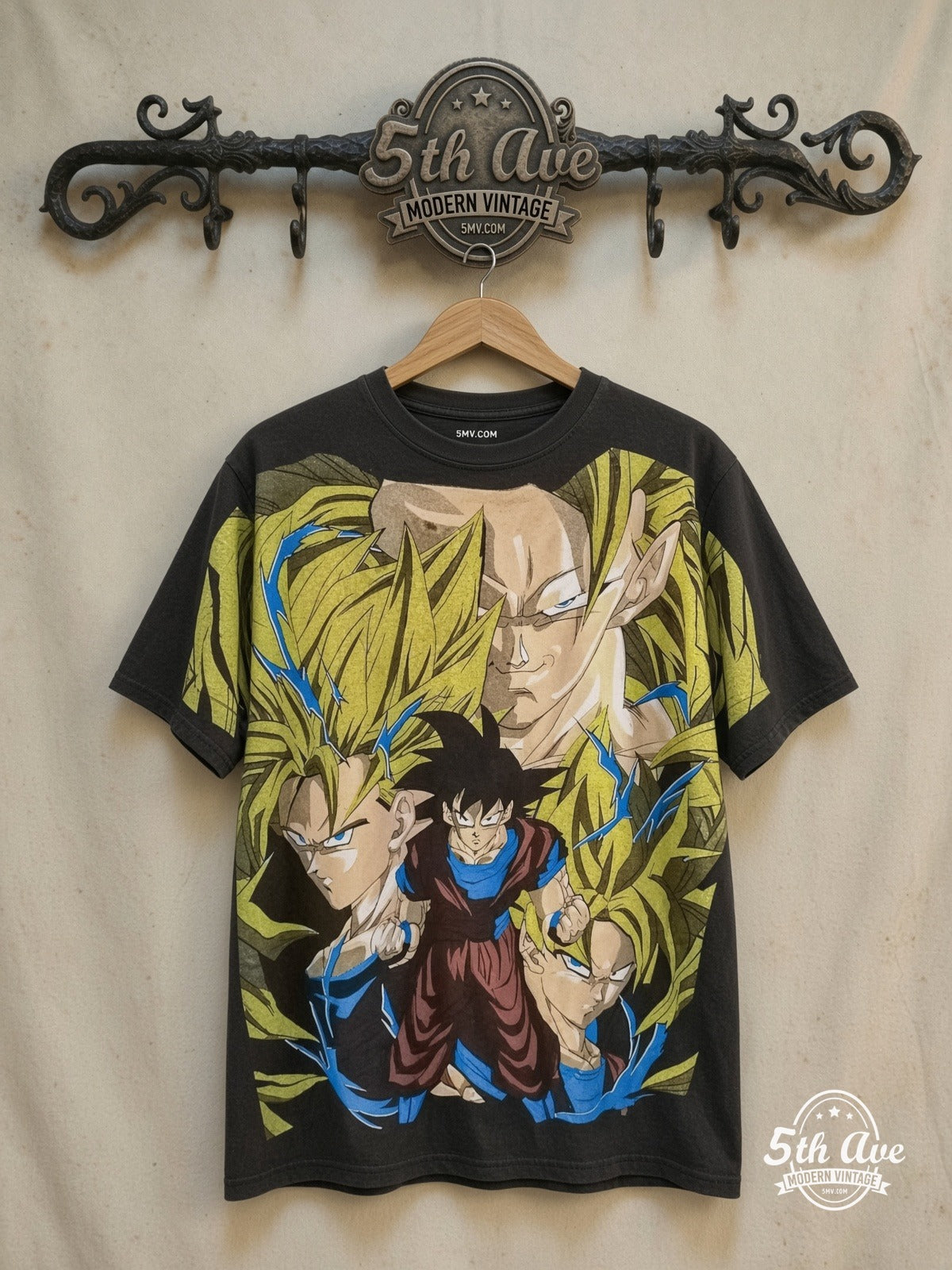 Unleashed Power: Goku's Evolution and Eternal Rivalry – All Over Print – New Vintage Anime Tee — front on locked cream ornate 5th Ave rack