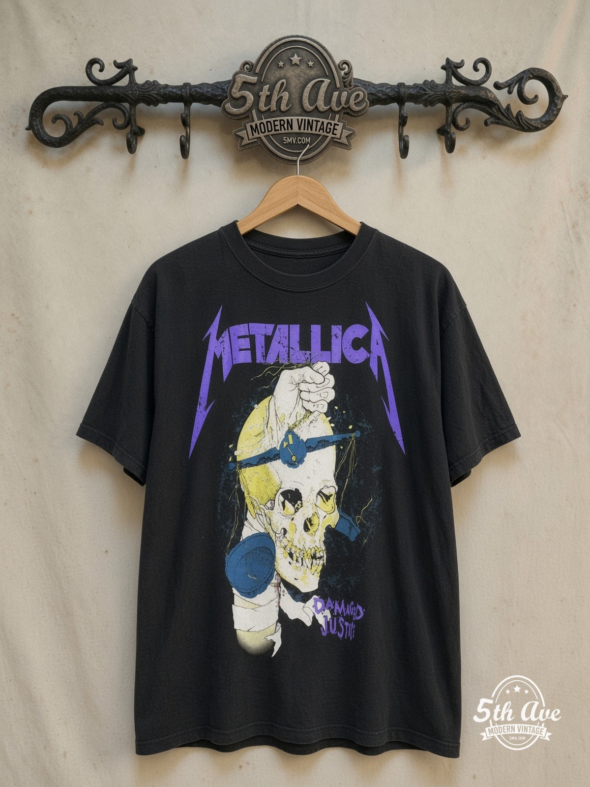Metallica – Damaged Justice Fist Through Skull – Vintage Band T-Shirt — front on locked cream ornate 5th Ave rack