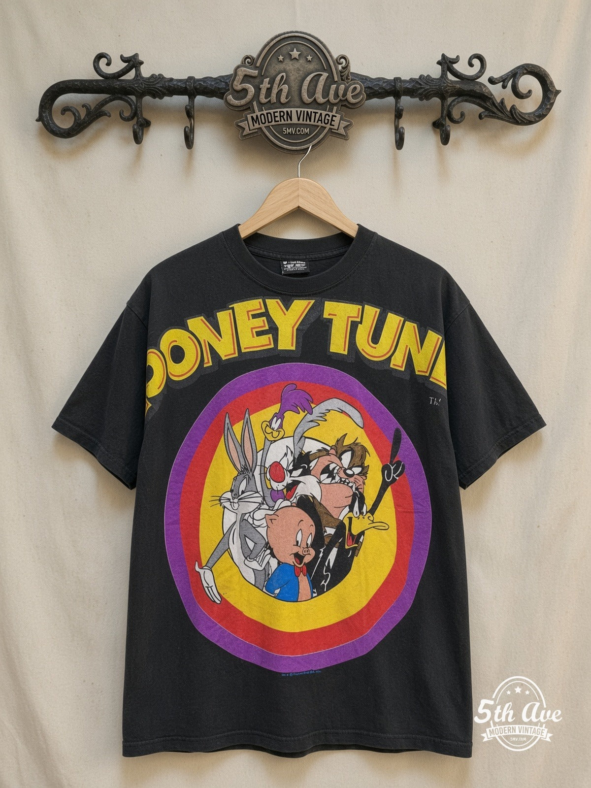 Looney Tunes – TuneSquad – New Vintage Graphic Tee — front on locked cream ornate 5th Ave rack