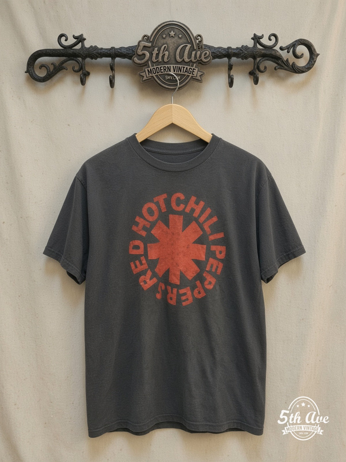 Red Hot Chili Peppers – Classic Red Asterisk Circle Logo – Vintage Band T-Shirt — front on locked cream ornate 5th Ave rack