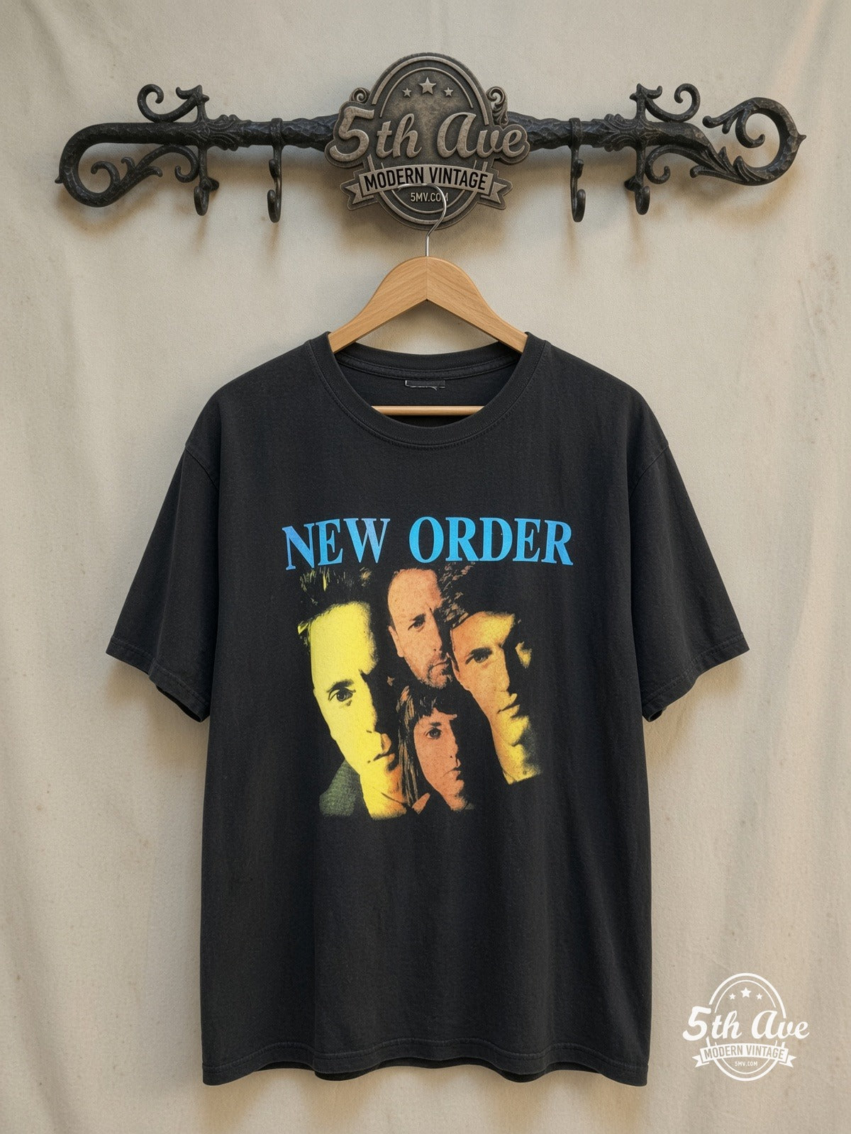 New Order – Vibrant Collage – Vintage Band T-Shirt — front on locked cream ornate 5th Ave rack