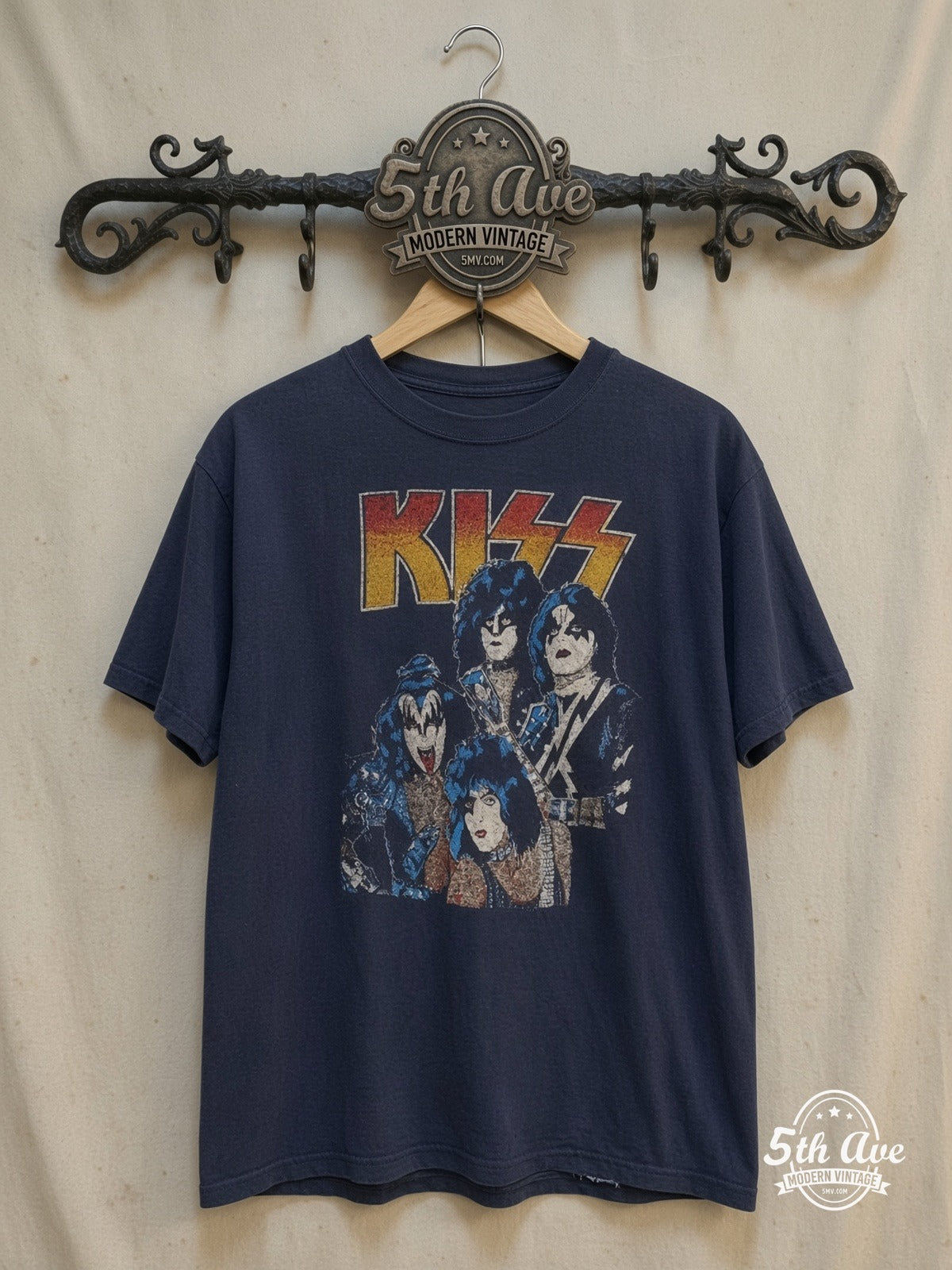KISS – Triple Logo – Vintage Band T-Shirt — front on locked cream ornate 5th Ave rack