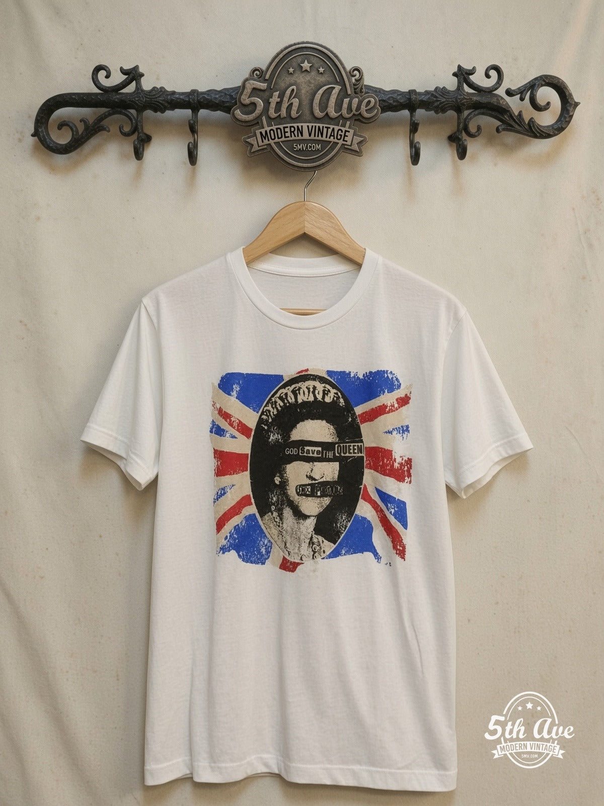 Sex Pistols – God Save the Queen – Vintage Band T-Shirt — front on locked cream ornate 5th Ave rack