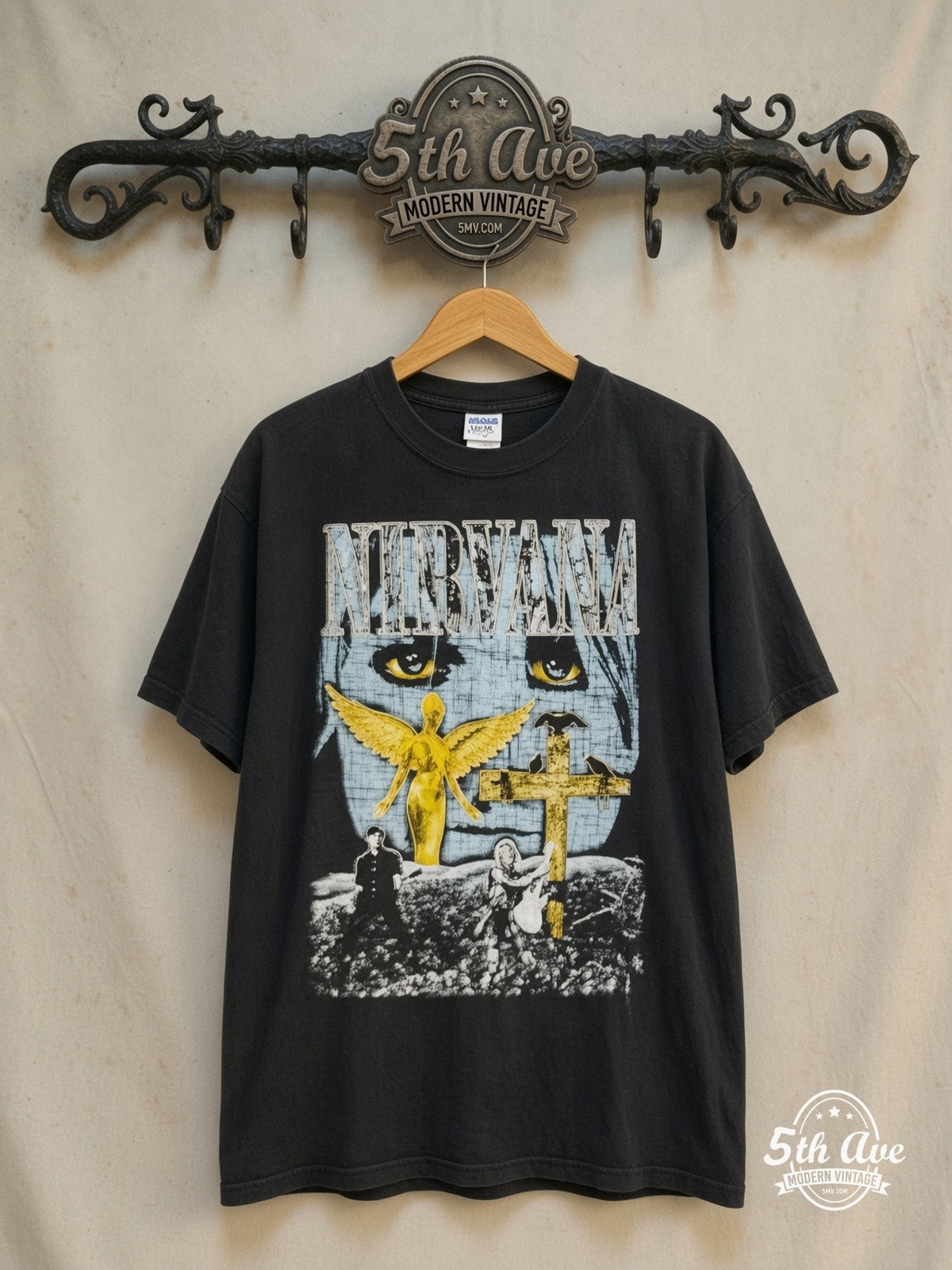 Nirvana – In Utero Gold Cross – Vintage Band T-Shirt — front on locked cream ornate 5th Ave rack