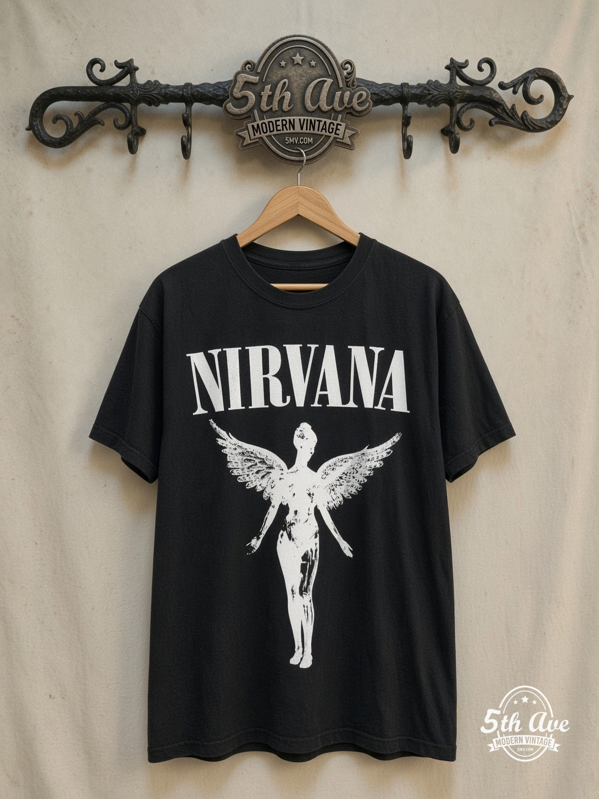 Nirvana – In Utero Glow in the Dark – Vintage Band T-Shirt — front on locked cream ornate 5th Ave rack
