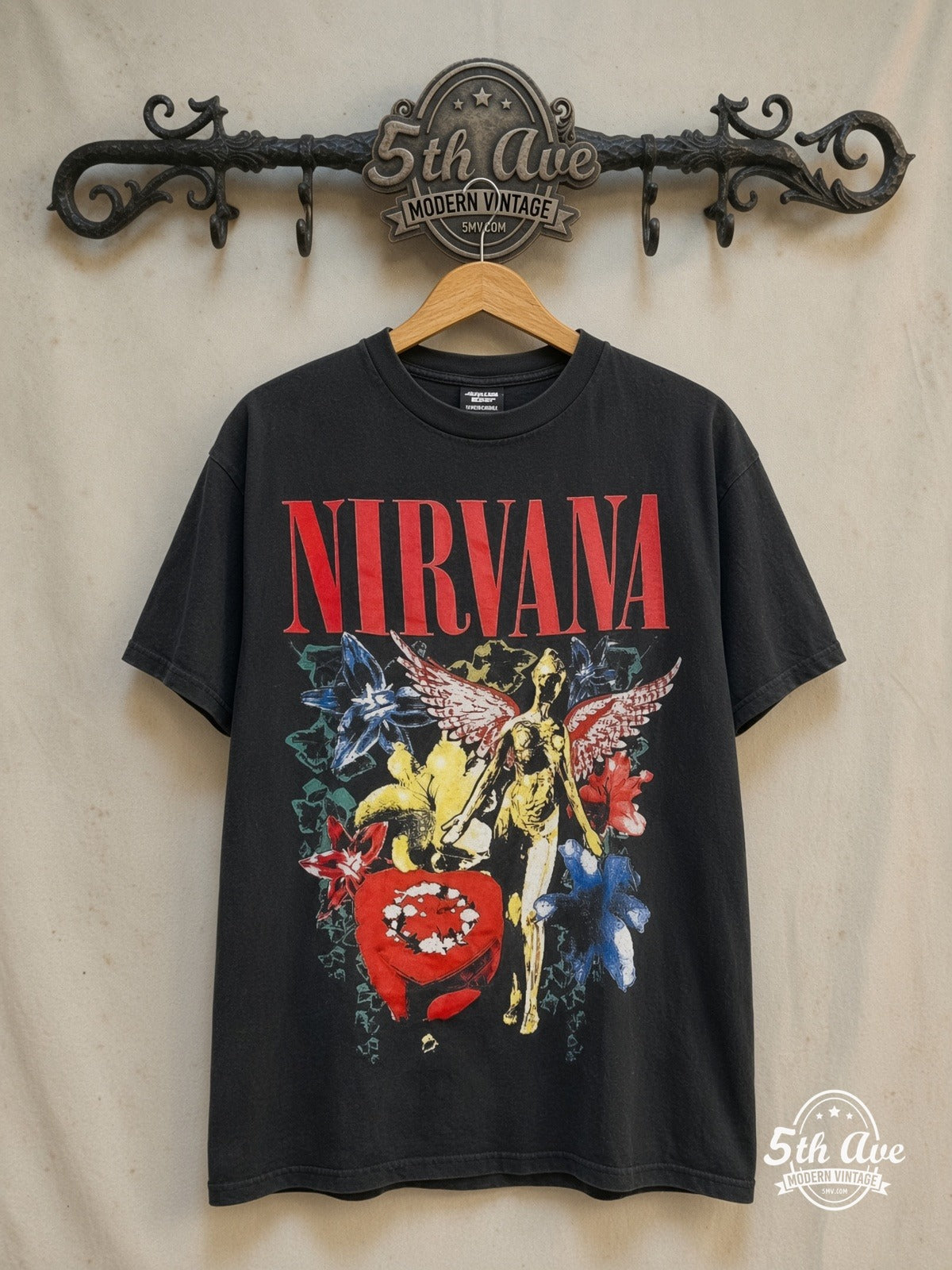 Nirvana – In Utero Colorful Flowers Angel Red Logo – Vintage Band T-Shirt — front on locked cream ornate 5th Ave rack