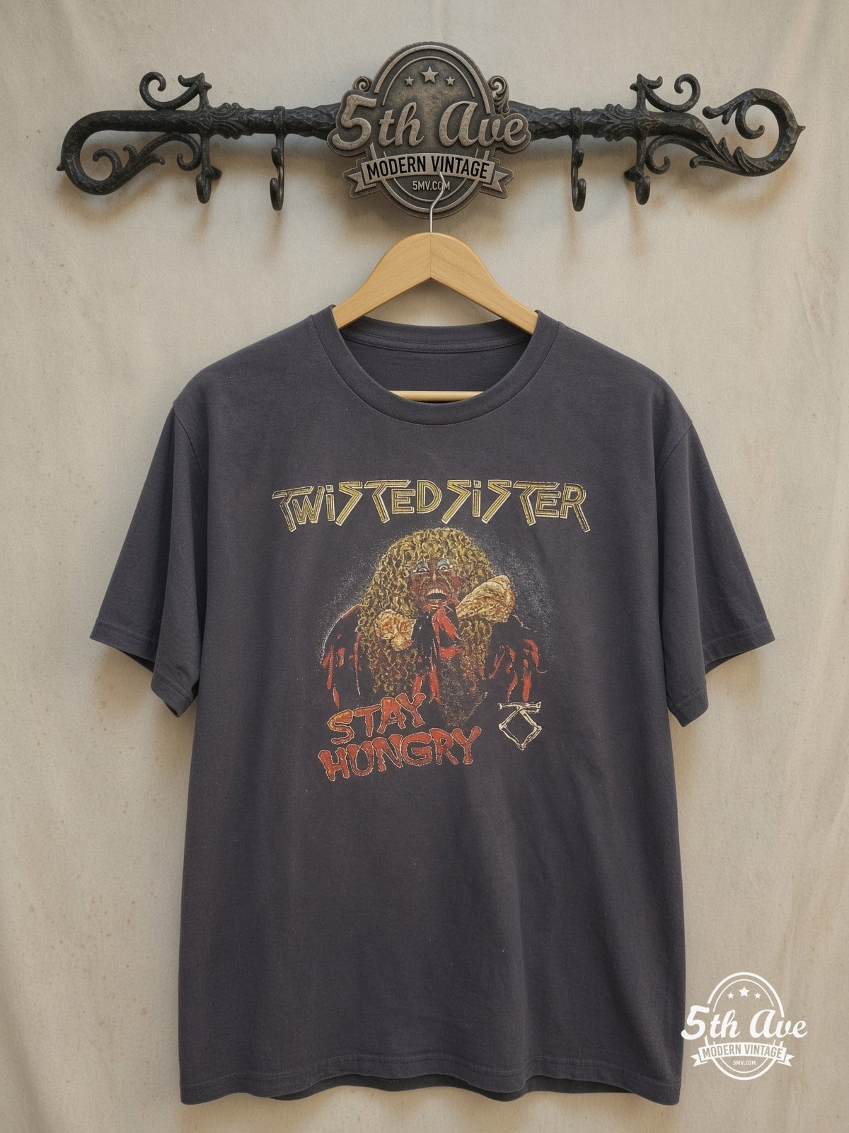 Twisted Sister – Stay Hungry Dee Snider Biting Bone – Vintage Band T-Shirt — front on locked cream ornate 5th Ave rack