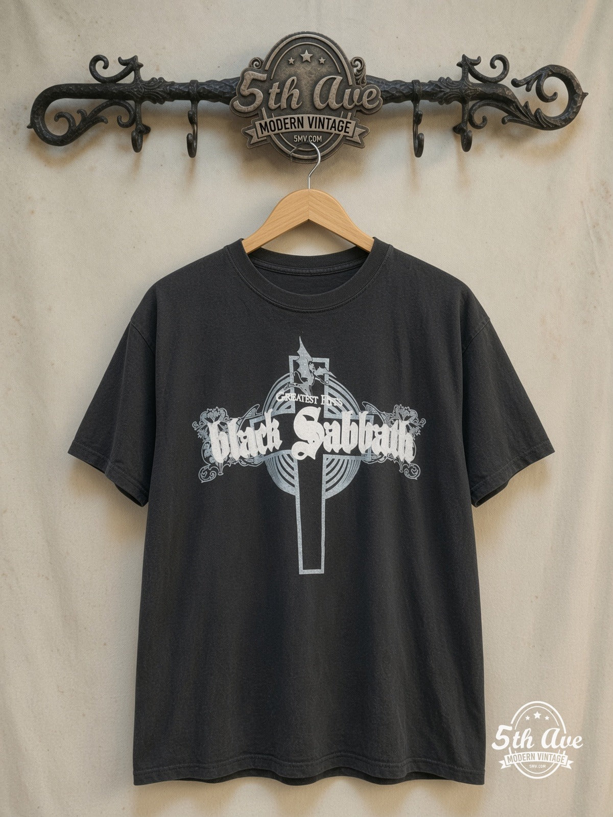 Black Sabbath – Greatest Hits – Vintage Band T-Shirt — front on locked cream ornate 5th Ave rack