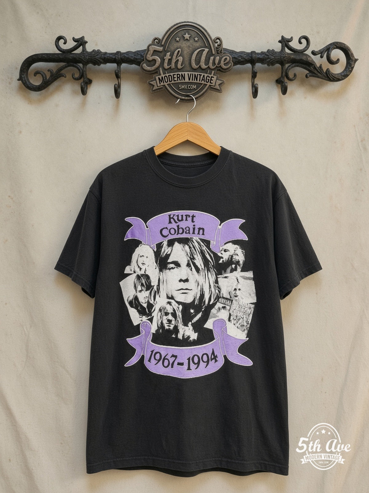 Nirvana – Kurt Cobain 1967-1994 – Vintage Band T-Shirt — front on locked cream ornate 5th Ave rack