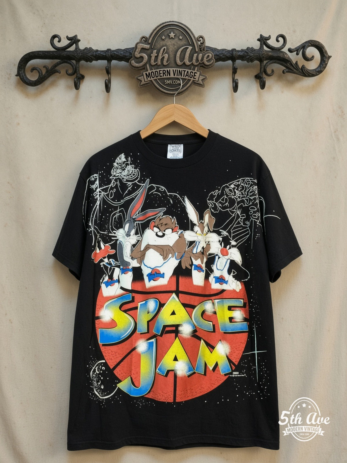 Looney Tunes – Space Jam - AOP all over print New Vintage Animation T-Shirt – New Vintage Graphic Tee — front on locked cream ornate 5th Ave rack