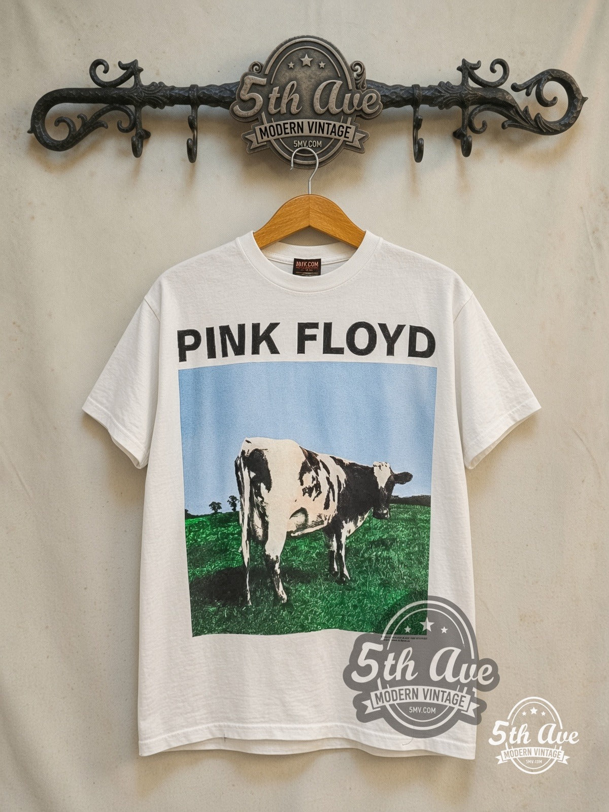 Pink Floyd – Atom Heart Mother Cow Stacked Back – Vintage Band T-Shirt — front on locked cream ornate 5th Ave rack