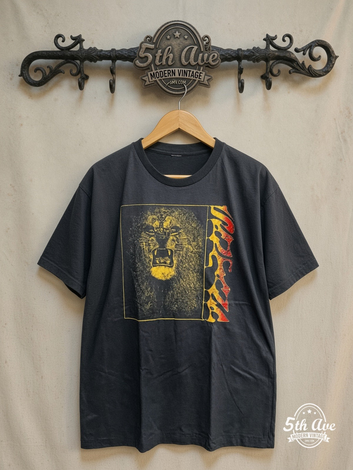 Santana – Vintage Band T-Shirt — front on locked cream ornate 5th Ave rack