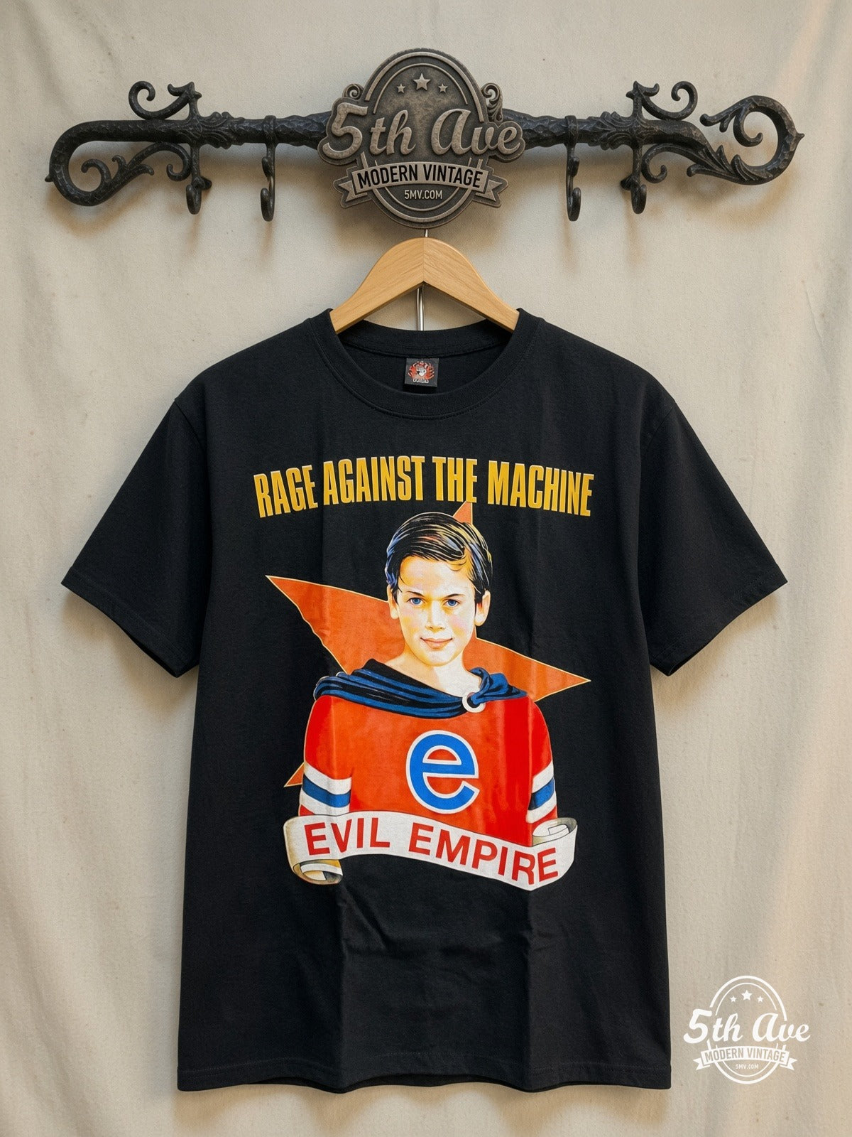 Rage Against the Machine – Evil Empire Boy Yellow Logo – Vintage Band T-Shirt — front on locked cream ornate 5th Ave rack