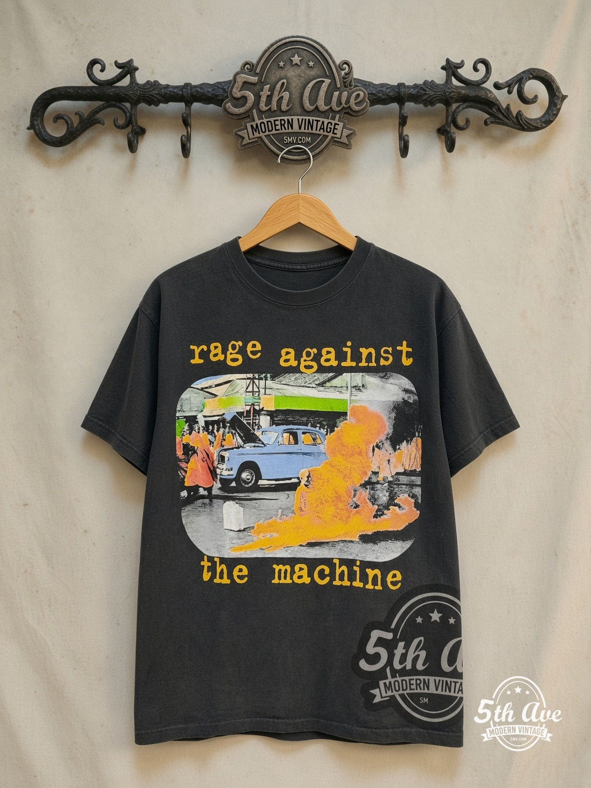 Rage Against the Machine – Burning Monk' Colored – Vintage Band T-Shirt — front on locked cream ornate 5th Ave rack
