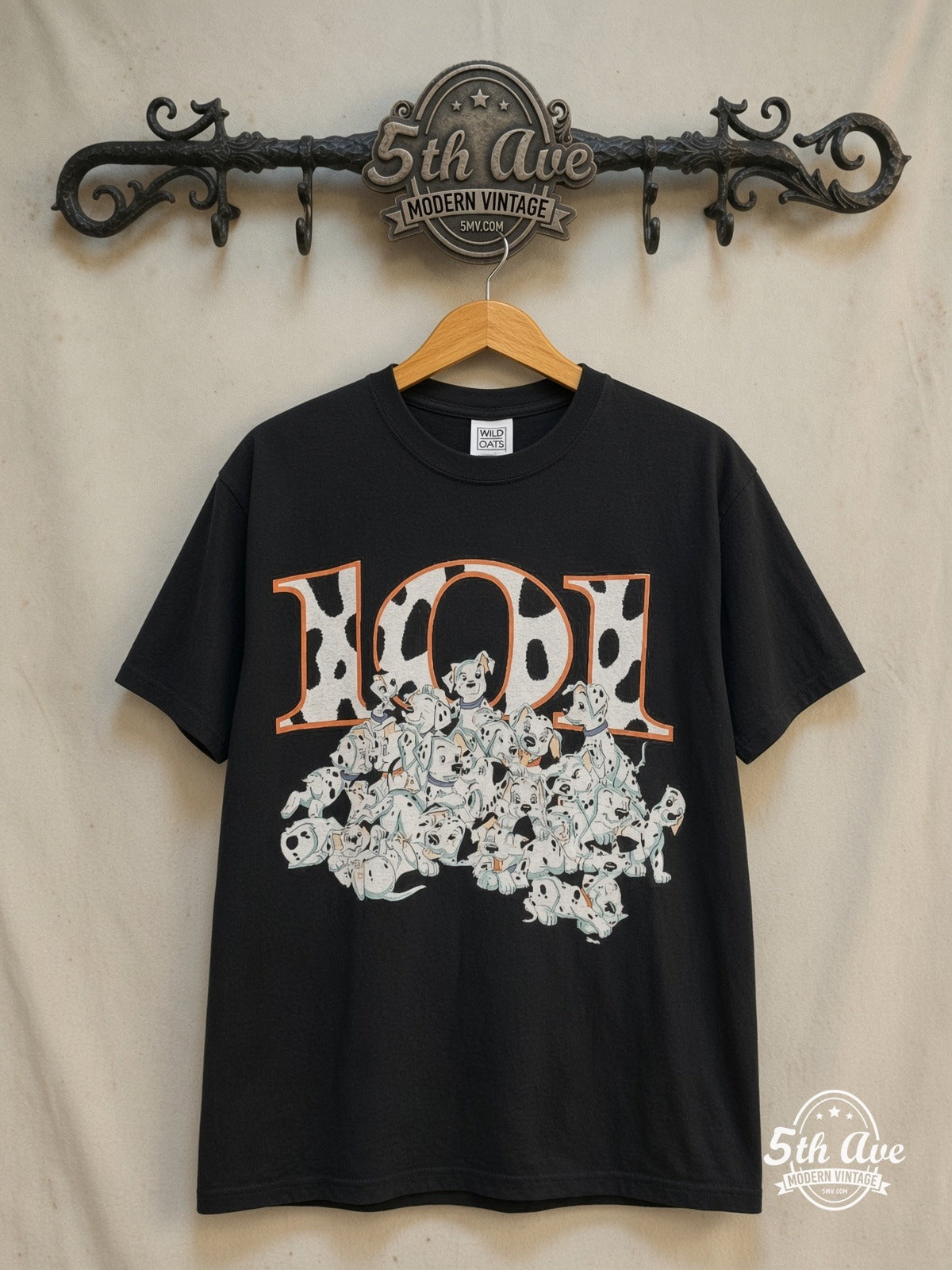 101 Dalmatians – 101 Puppies Pile – New Vintage Graphic Tee — front on locked cream ornate 5th Ave rack