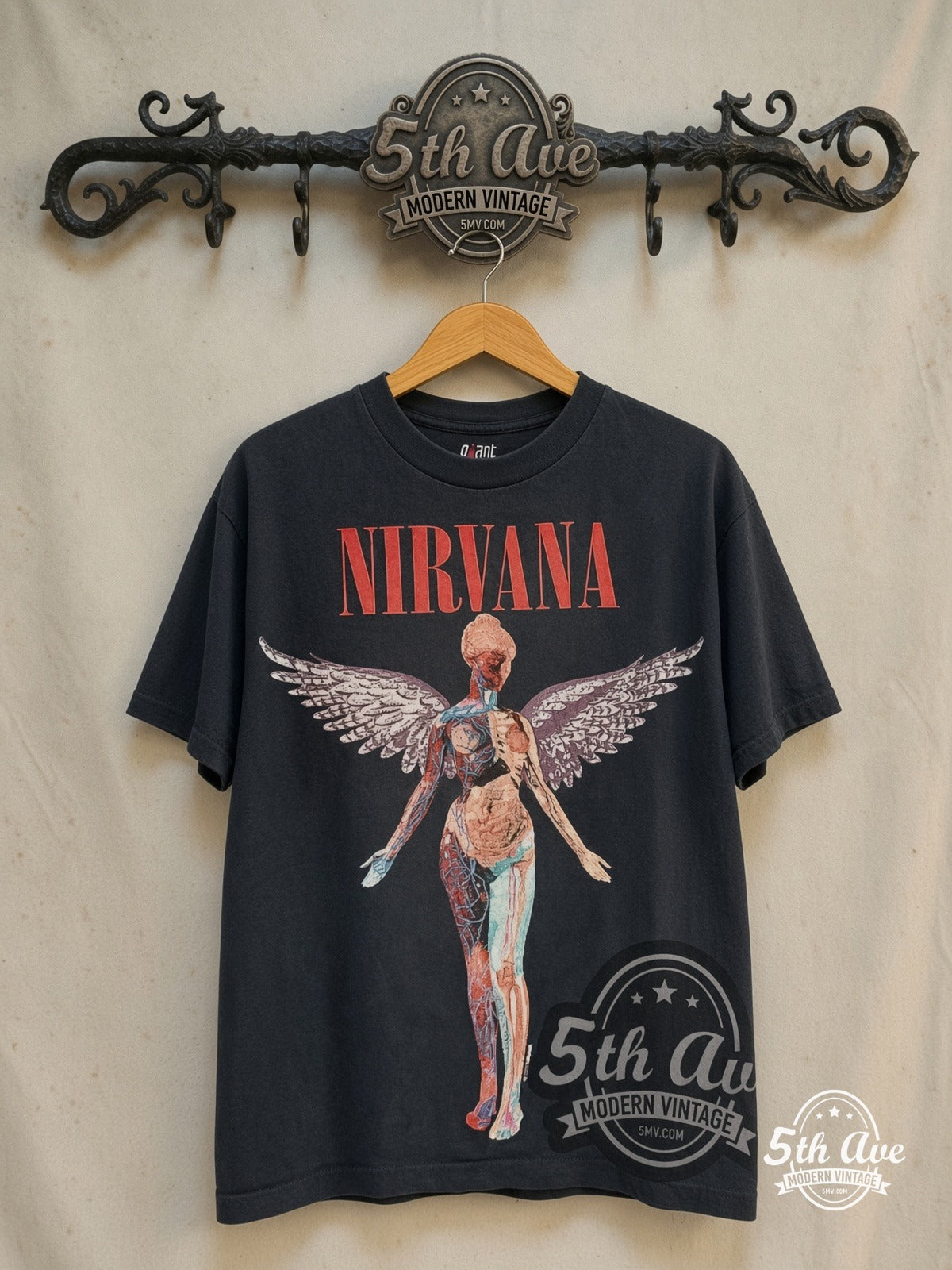 Nirvana – In Utero Red Block Logo Color Anatomical Angel – Vintage Band T-Shirt — front on locked cream ornate 5th Ave rack