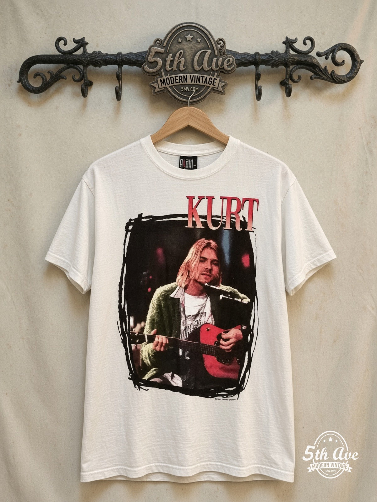 Nirvana – Kurt Cobain Playing Guitar – Vintage Band T-Shirt — front on locked cream ornate 5th Ave rack