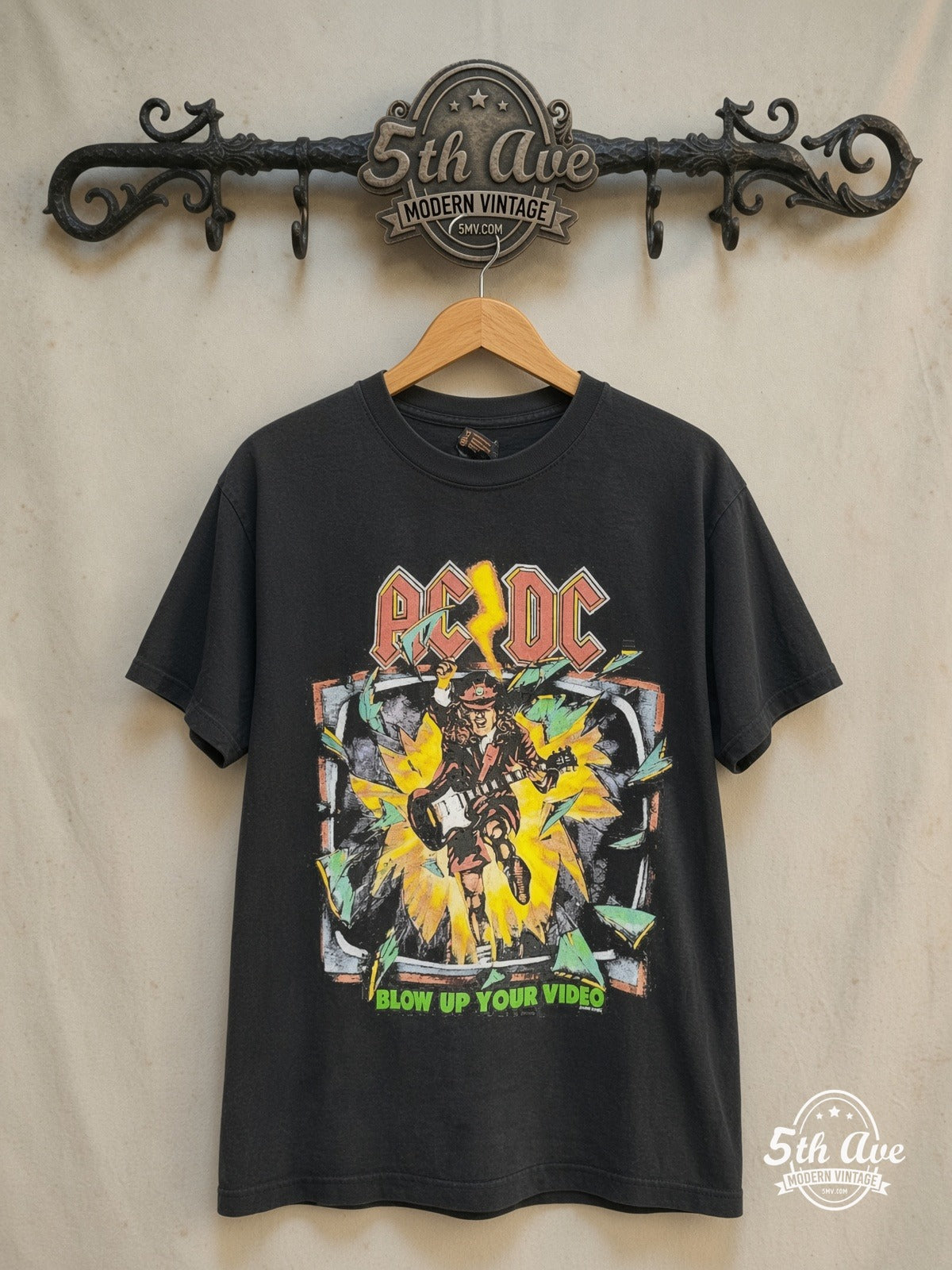 AC/DC – Blow Up Your Video TV Burst City List – Vintage Band T-Shirt — front on locked cream ornate 5th Ave rack