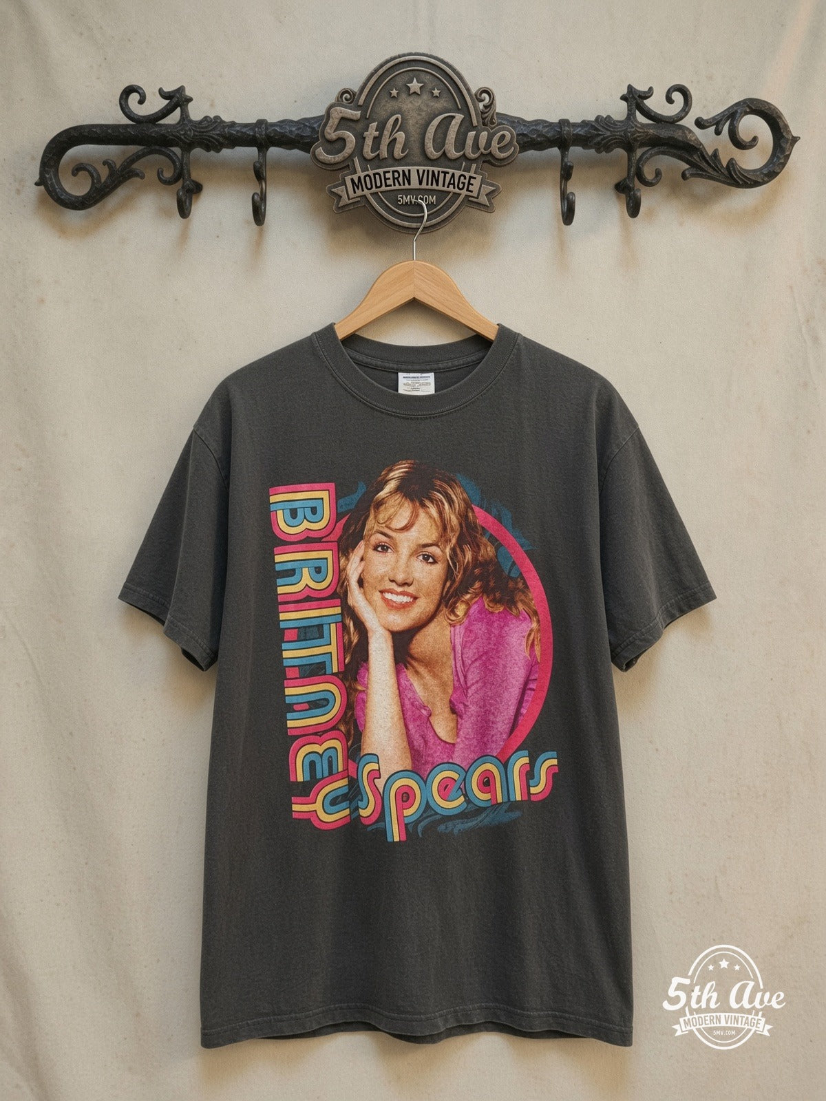 Britney Baby One More Time T-Shirt — front on locked cream ornate 5th Ave rack
