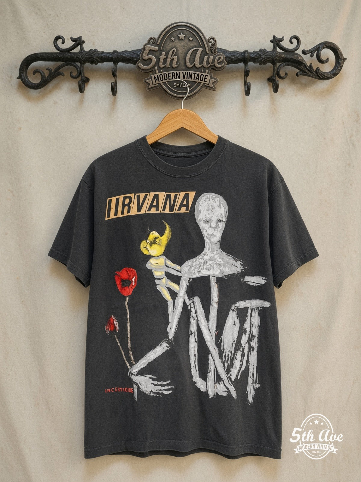 Nirvana – Incesticide – Vintage Band T-Shirt — front on locked cream ornate 5th Ave rack
