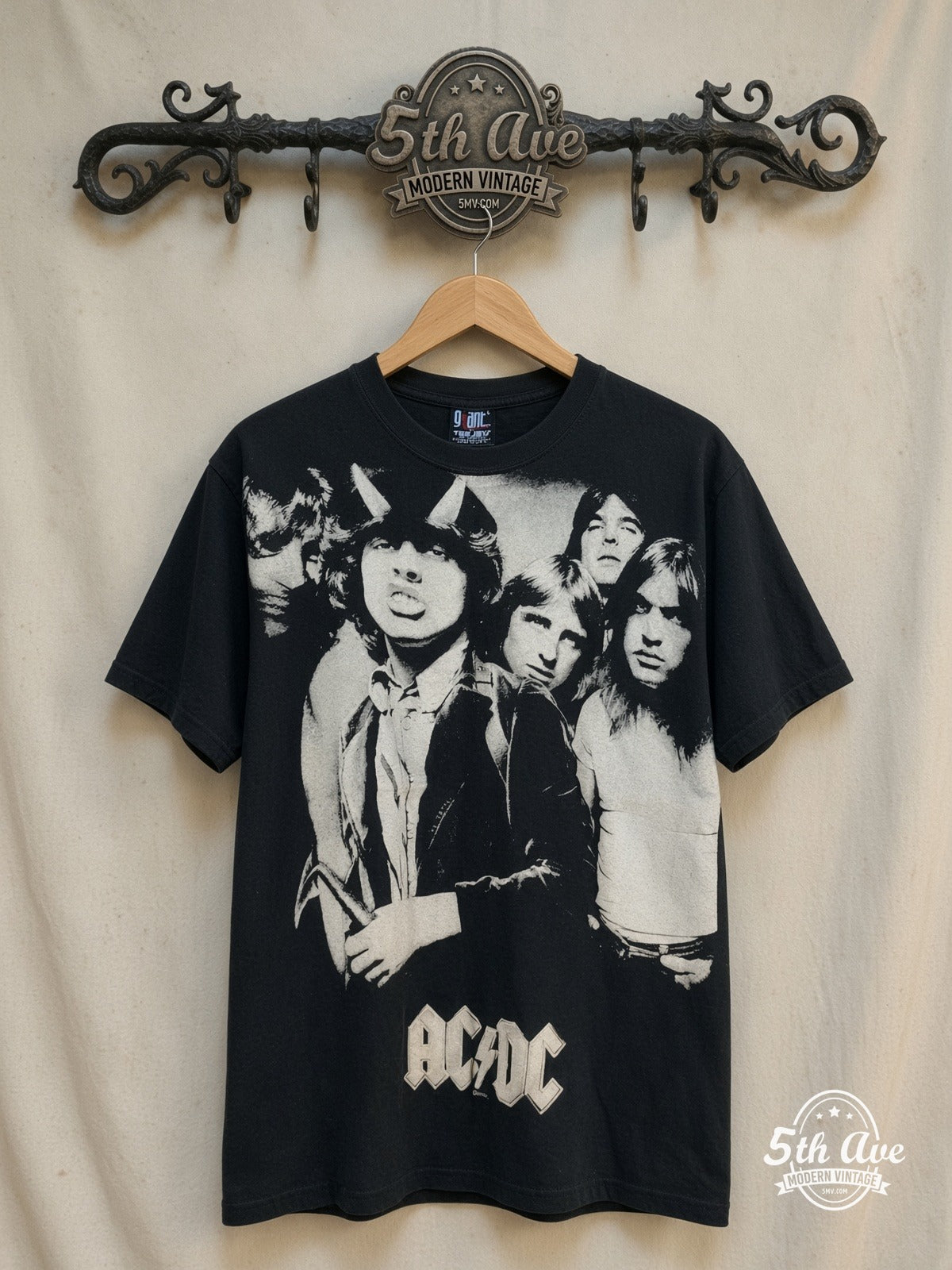 AC/DC – AC/DC – All Over Print – Vintage Band T-Shirt — front on locked cream ornate 5th Ave rack