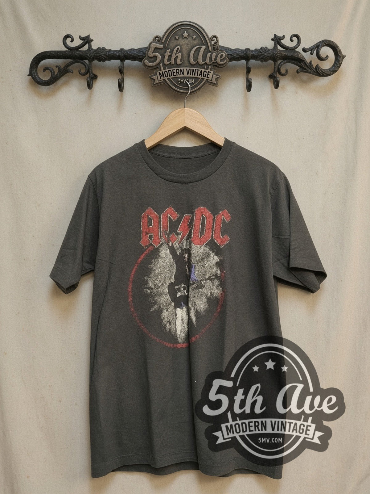 AC/DC 1988 World Tour vintage band t-shirt, front view on a display rack