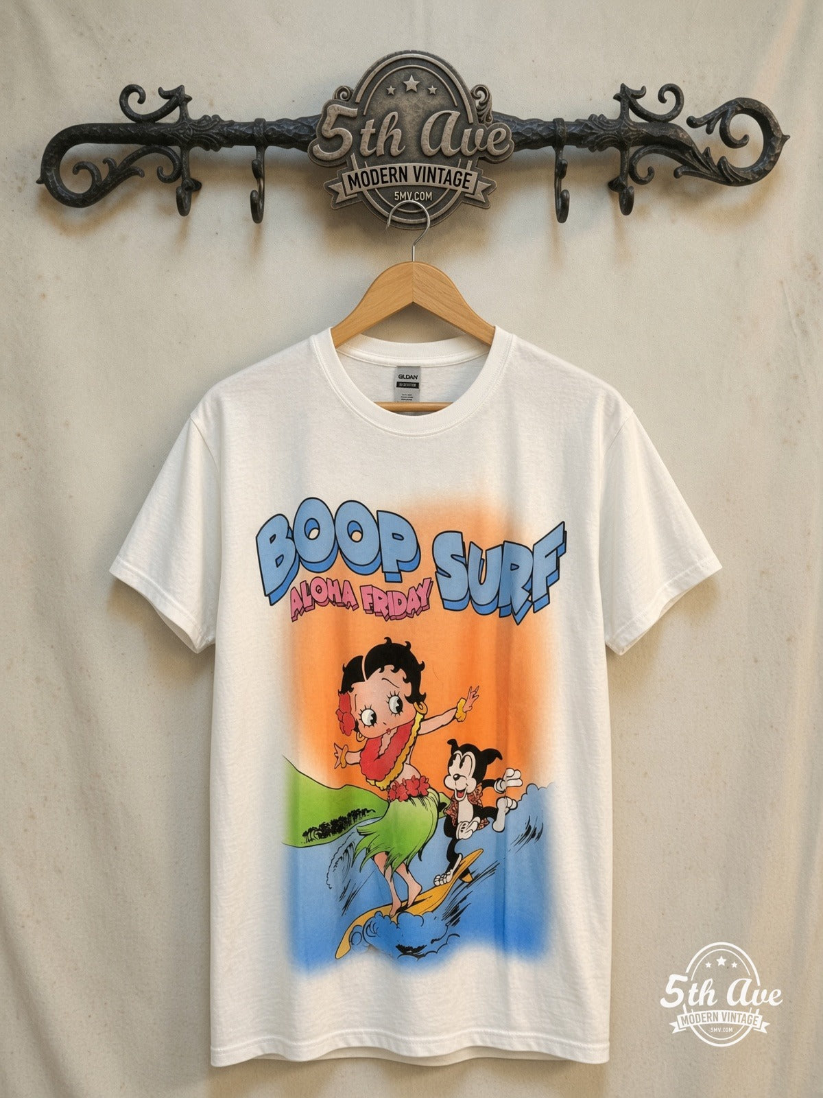 Betty Boop – Boop Surf Aloha Friday – New Vintage Graphic Tee — front on locked cream ornate 5th Ave rack