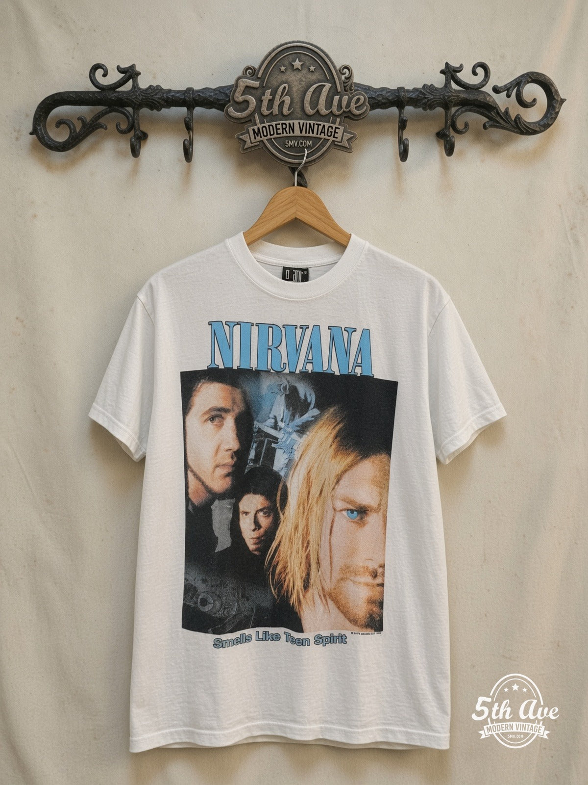 Nirvana – Memorial – Vintage Band T-Shirt — front on locked cream ornate 5th Ave rack