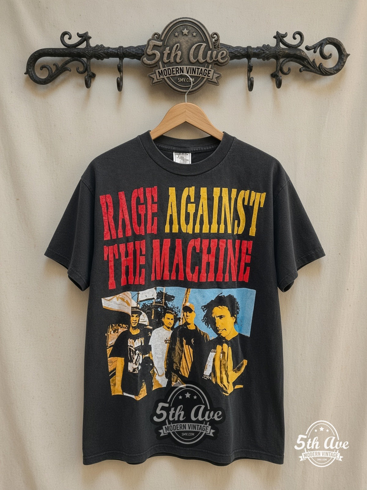 Rage Against the Machine – Against All Odds – Vintage Band T-Shirt — front on locked cream ornate 5th Ave rack