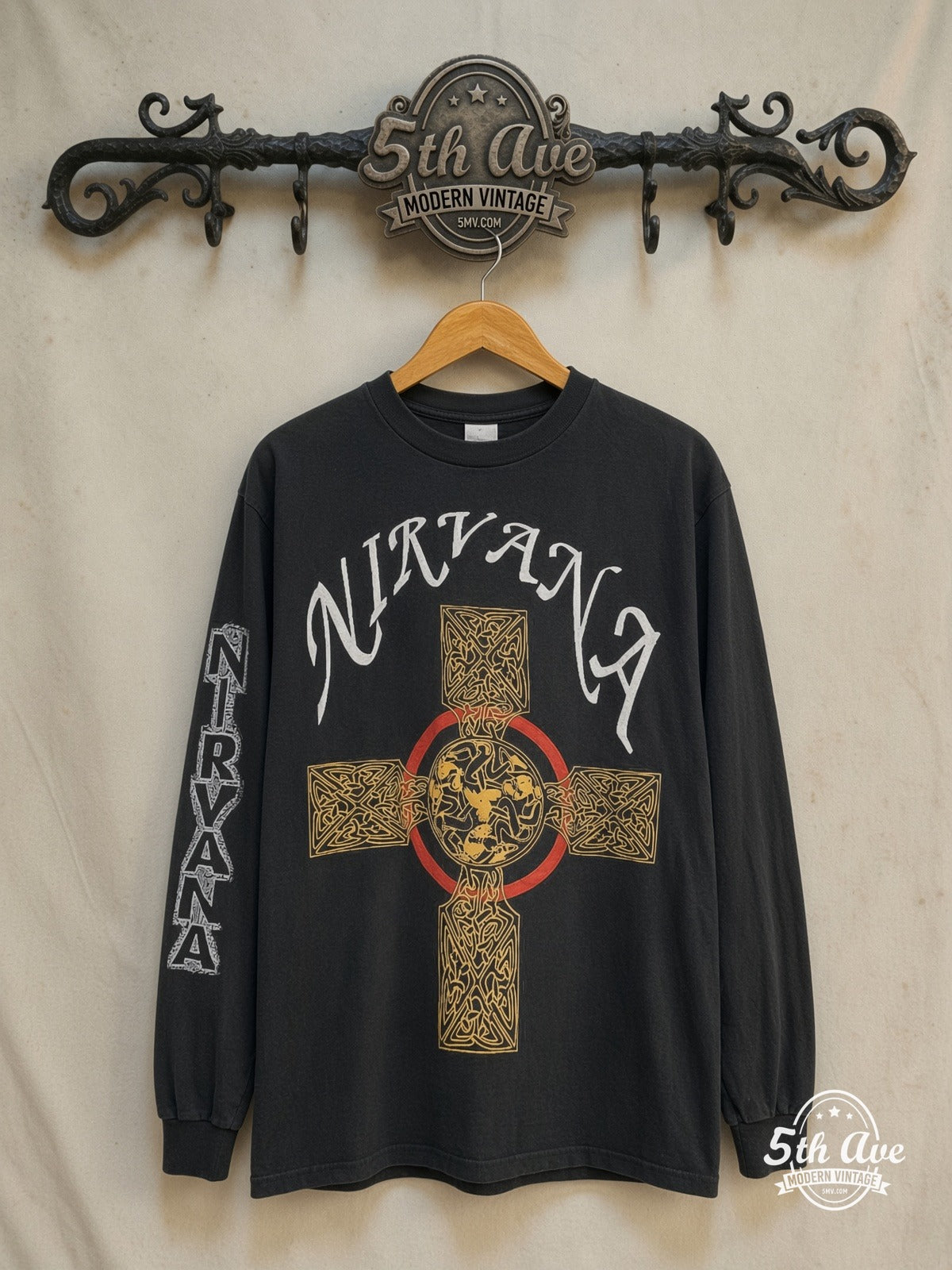 Nirvana – Pagan Cross 1991 – Vintage Band T-Shirt — front on locked cream ornate 5th Ave rack