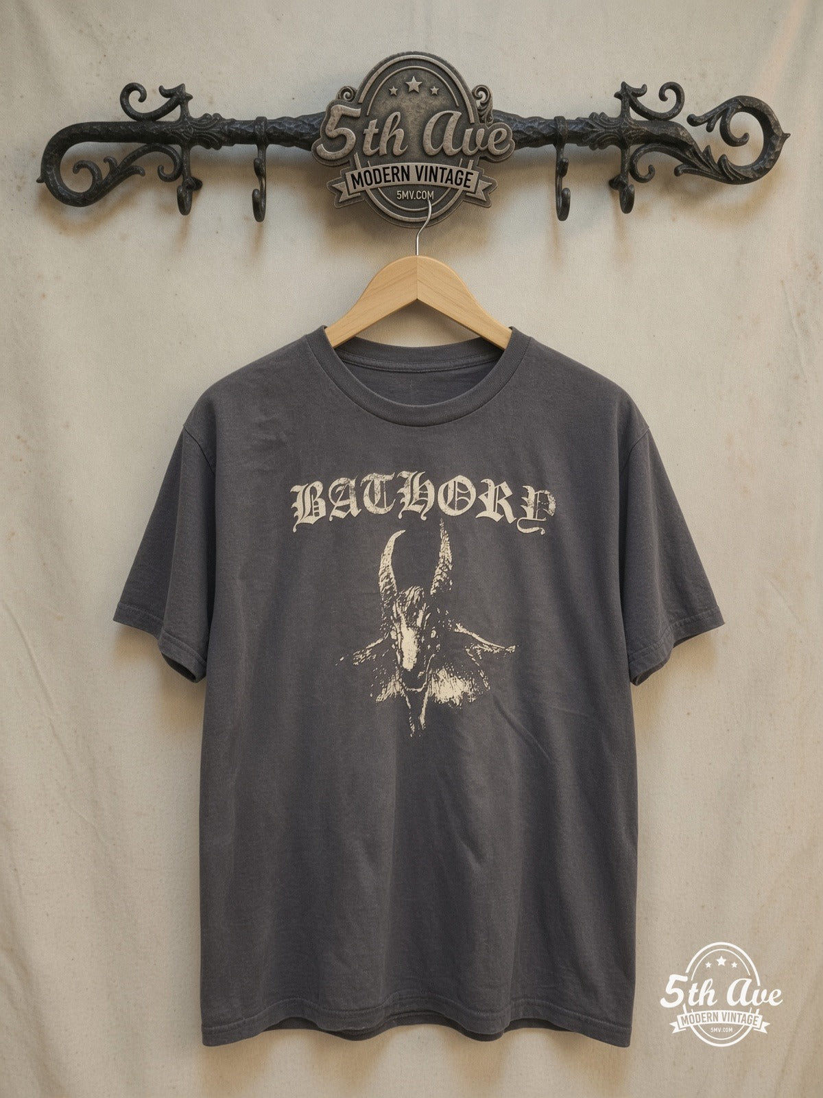 Eclipsing Legacies: Unveiling the Bathory Enigma t shirt – Vintage Band T-Shirt — front on locked cream ornate 5th Ave rack