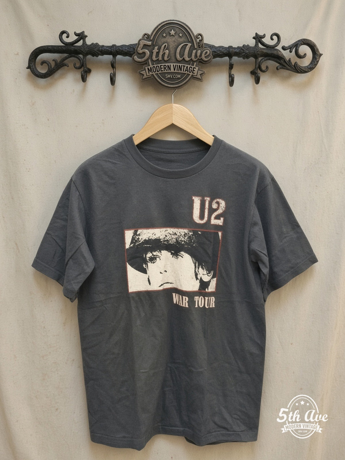 U2 – Vintage Band T-Shirt — front on locked cream ornate 5th Ave rack