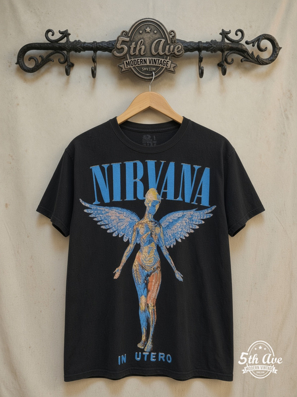 Nirvana – In Utero Blue Logo Anatomical Angel – Vintage Band T-Shirt — front on locked cream ornate 5th Ave rack