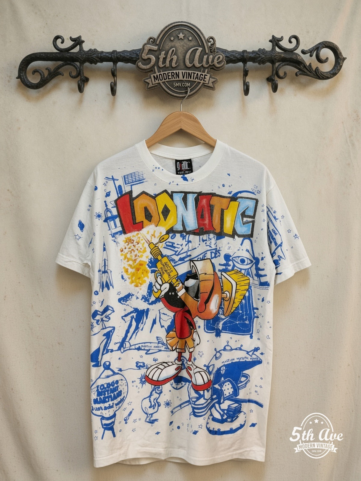 Looney Tunes – Marvin the Martian Loonatic Streetwear – All Over Print – New Vintage Graphic Tee — front on locked cream ornate 5th Ave rack
