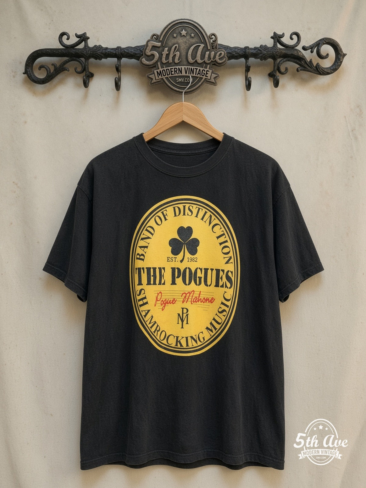 The Pogues – Pogue Mahone – Vintage Band T-Shirt — front on locked cream ornate 5th Ave rack