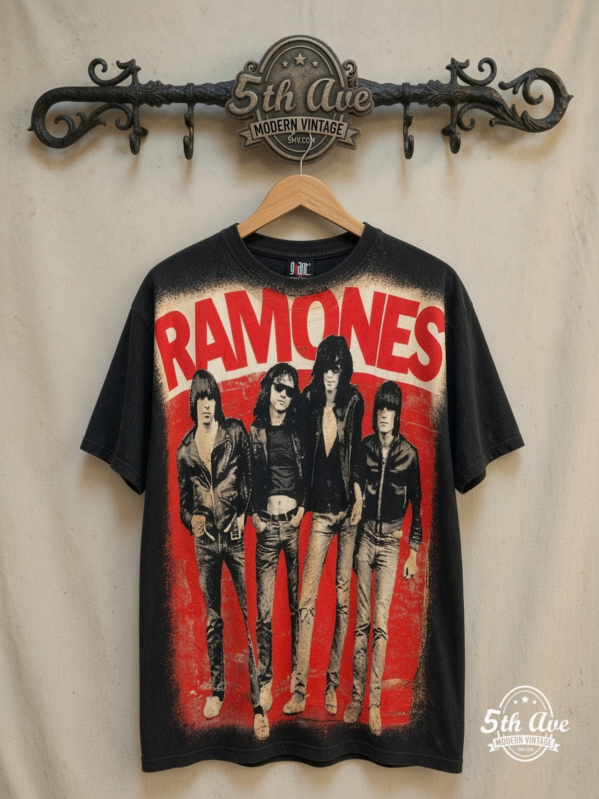 The Ramones – All Over Print – Vintage Band T-Shirt — front on locked cream ornate 5th Ave rack