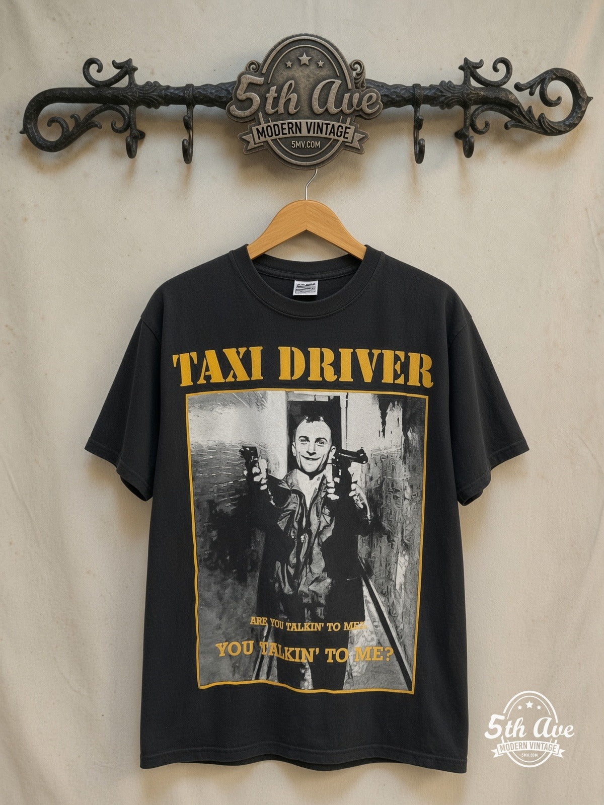 Taxi Driver – All-Over Print – Vintage Movie Tee — front on locked cream ornate 5th Ave rack