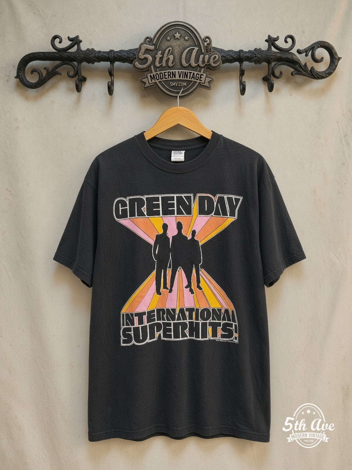 Green Day – International Superhits Tour – Vintage Band T-Shirt — front on locked cream ornate 5th Ave rack