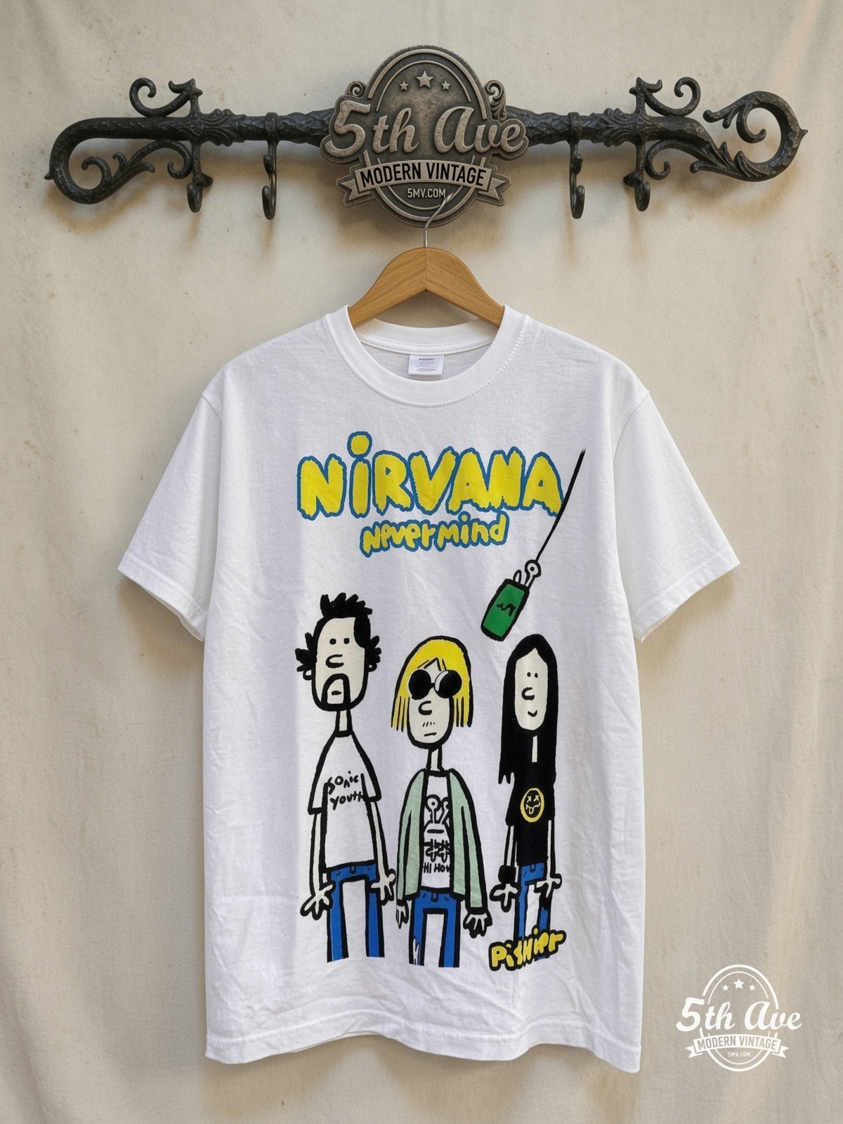 Nirvana – Nevermind Pishier Art – Vintage Band T-Shirt — front on locked cream ornate 5th Ave rack