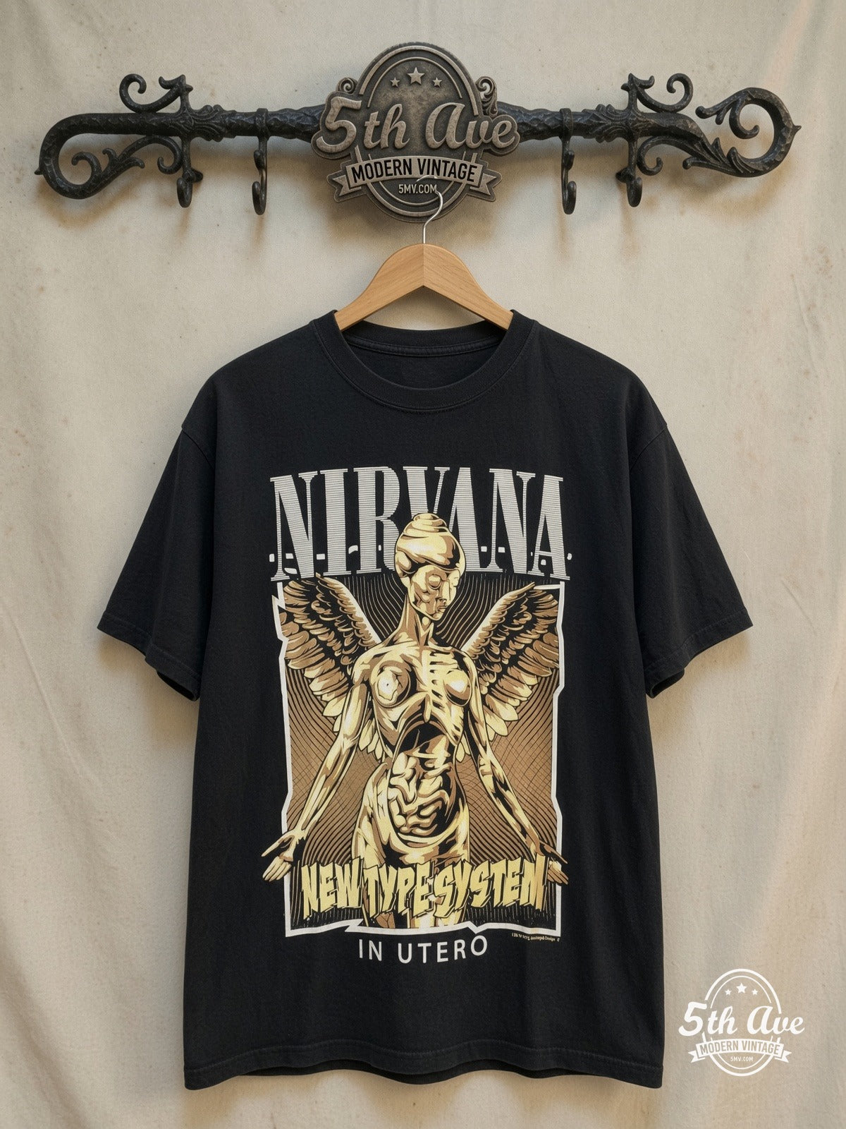 Nirvana – In Utero New Type System Angel – Vintage Band T-Shirt — front on locked cream ornate 5th Ave rack