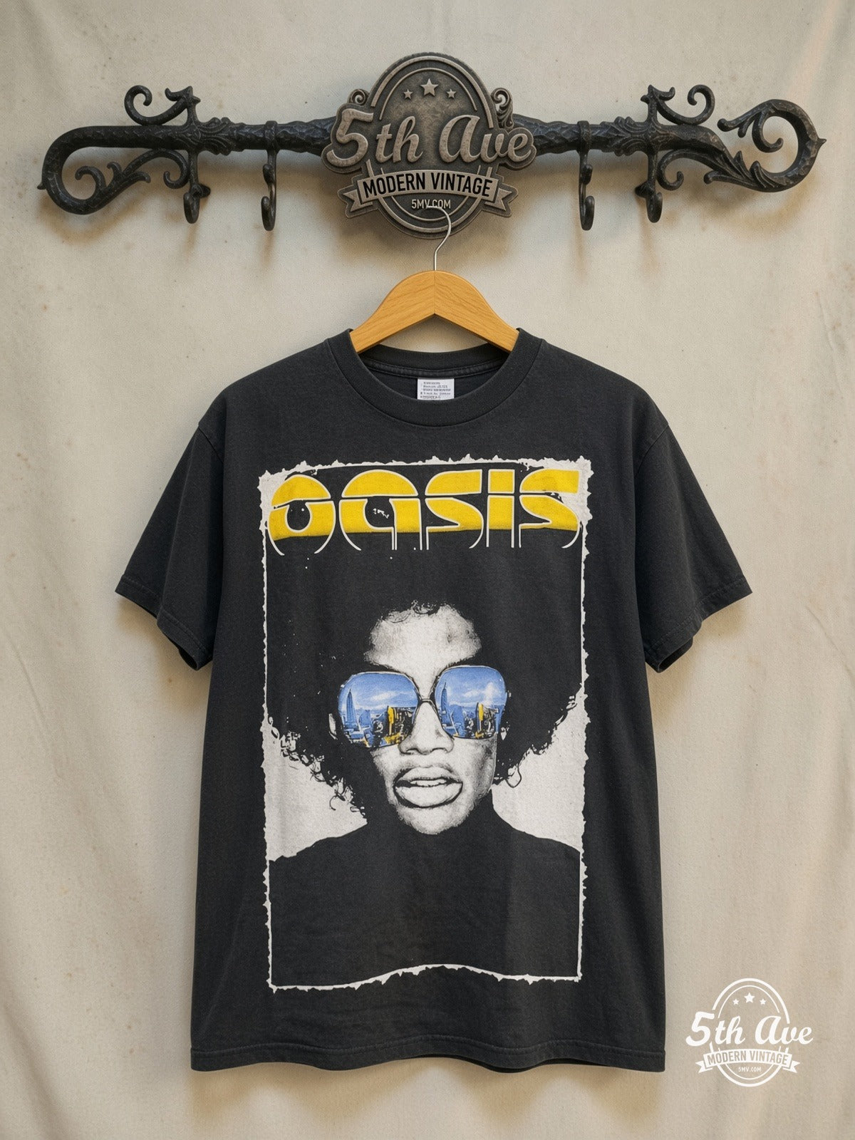 Oasis – The Charlatans, Black Rebel Motorcycle Club, Proud Mary and The Coral  – Vintage Band T-Shirt — front on locked cream ornate 5th Ave rack