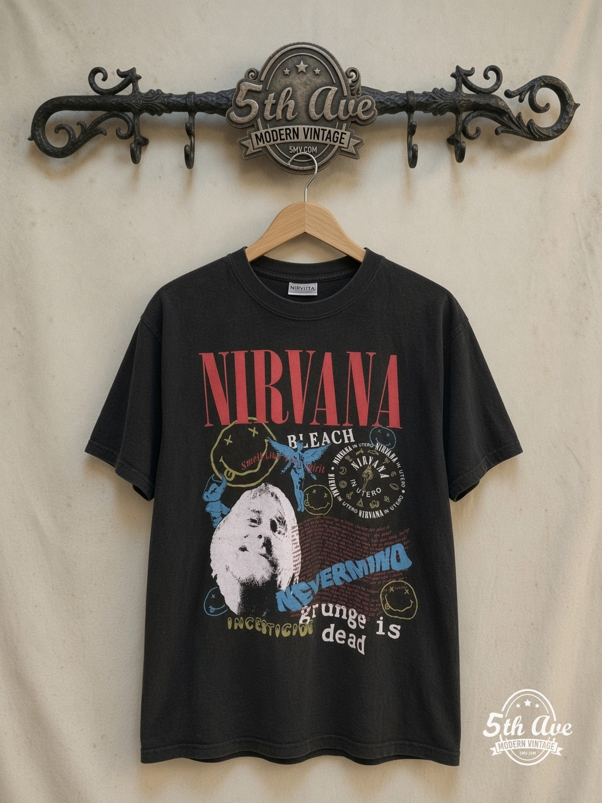 Nirvana – Album Collage – Vintage Band T-Shirt — front on locked cream ornate 5th Ave rack