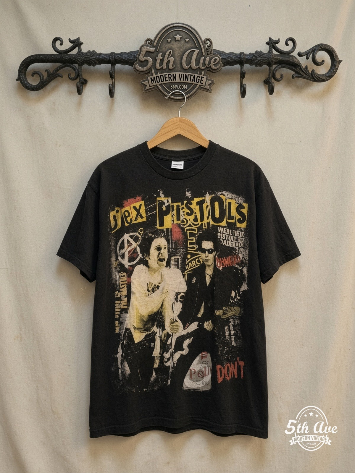 Sex Pistols Sid Vicious Distressed T-Shirt — front on locked cream ornate 5th Ave rack