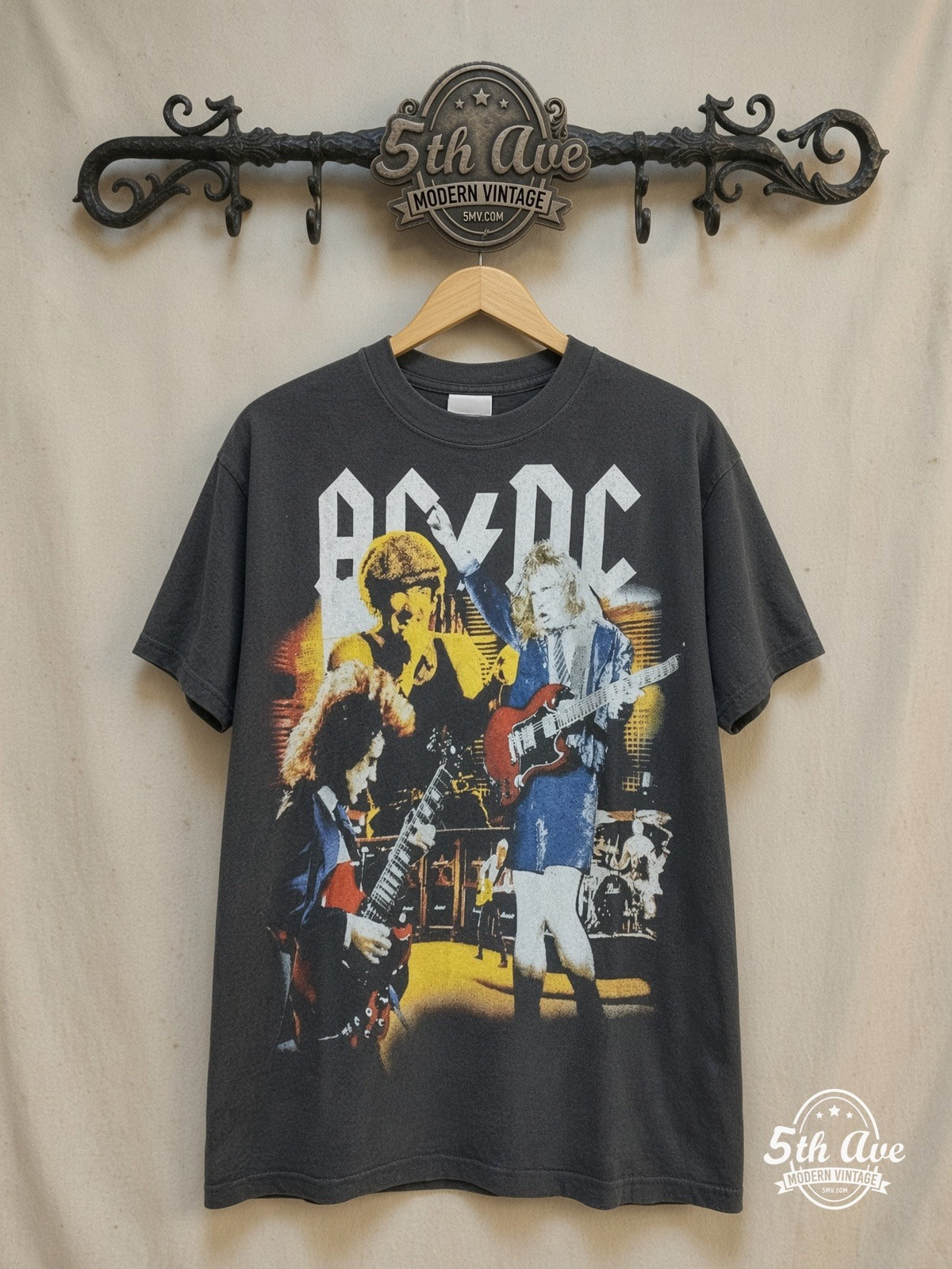 AC/DC – Bootleg Graphic – Vintage Band T-Shirt — front on locked cream ornate 5th Ave rack